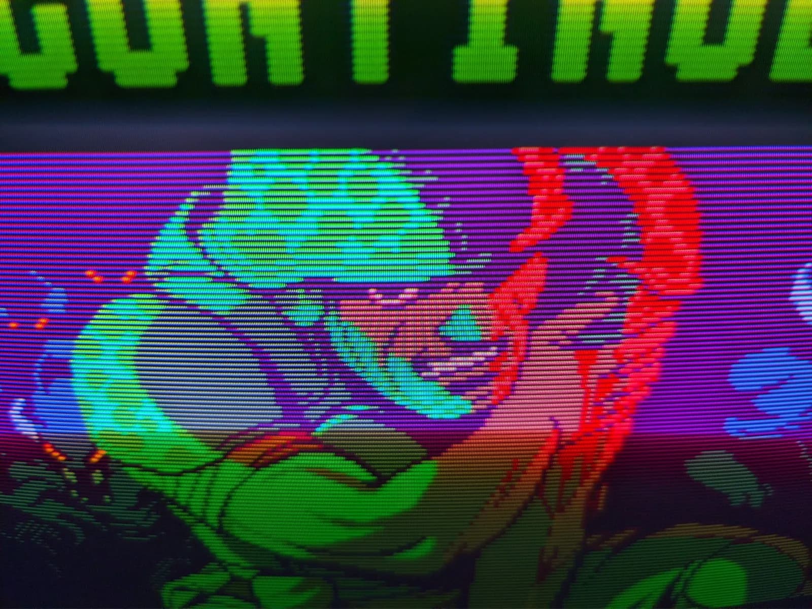 Sony PVM-14M4J displaying colorful test pattern with cyan, red, and green gradients; retrace lines visible across screen after repair.