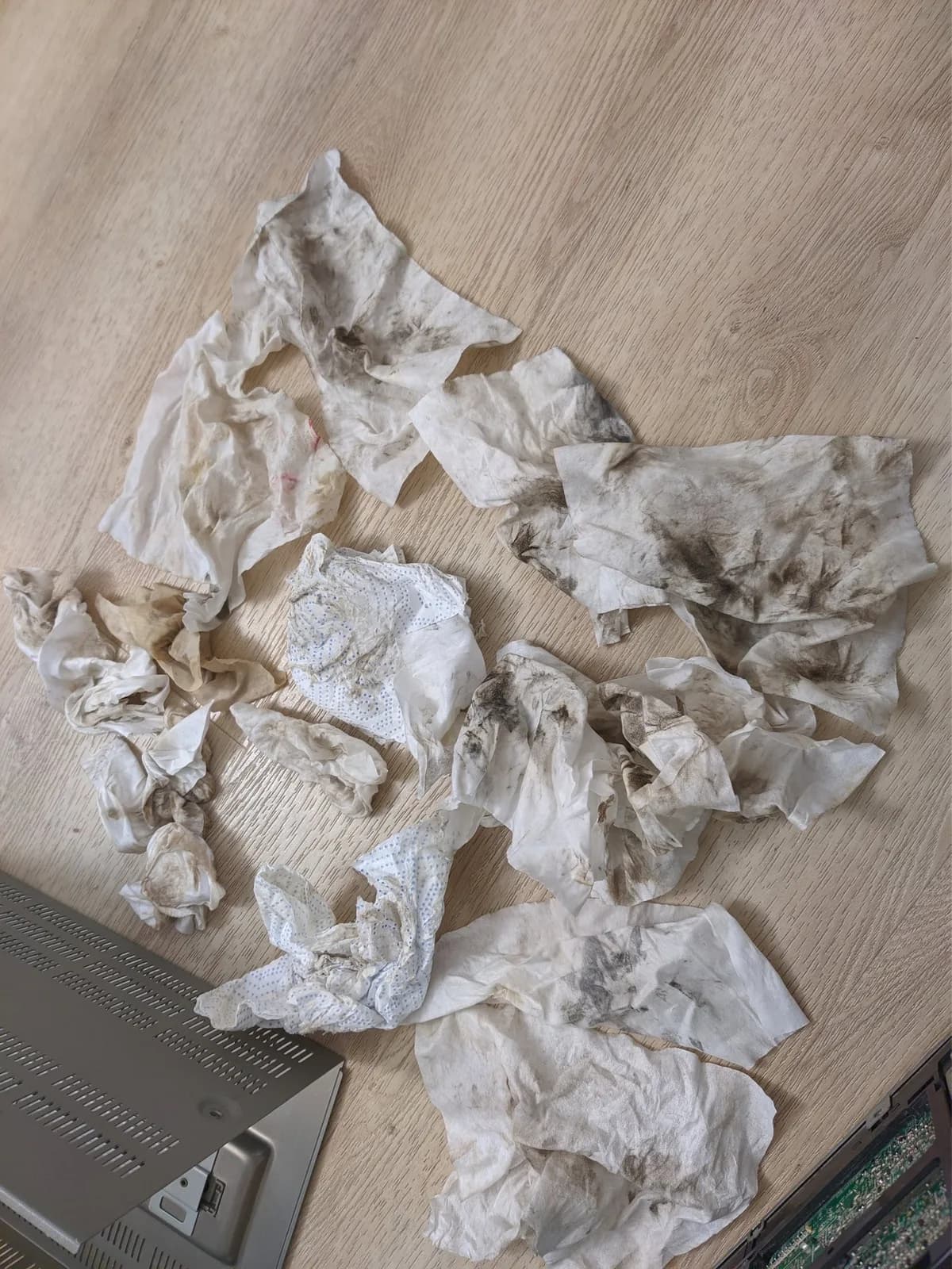 Used tissues and cleaning materials from Sony BVM-9045QD restoration, showing heavy nicotine and dust buildup removal during CRT monitor restoration process.