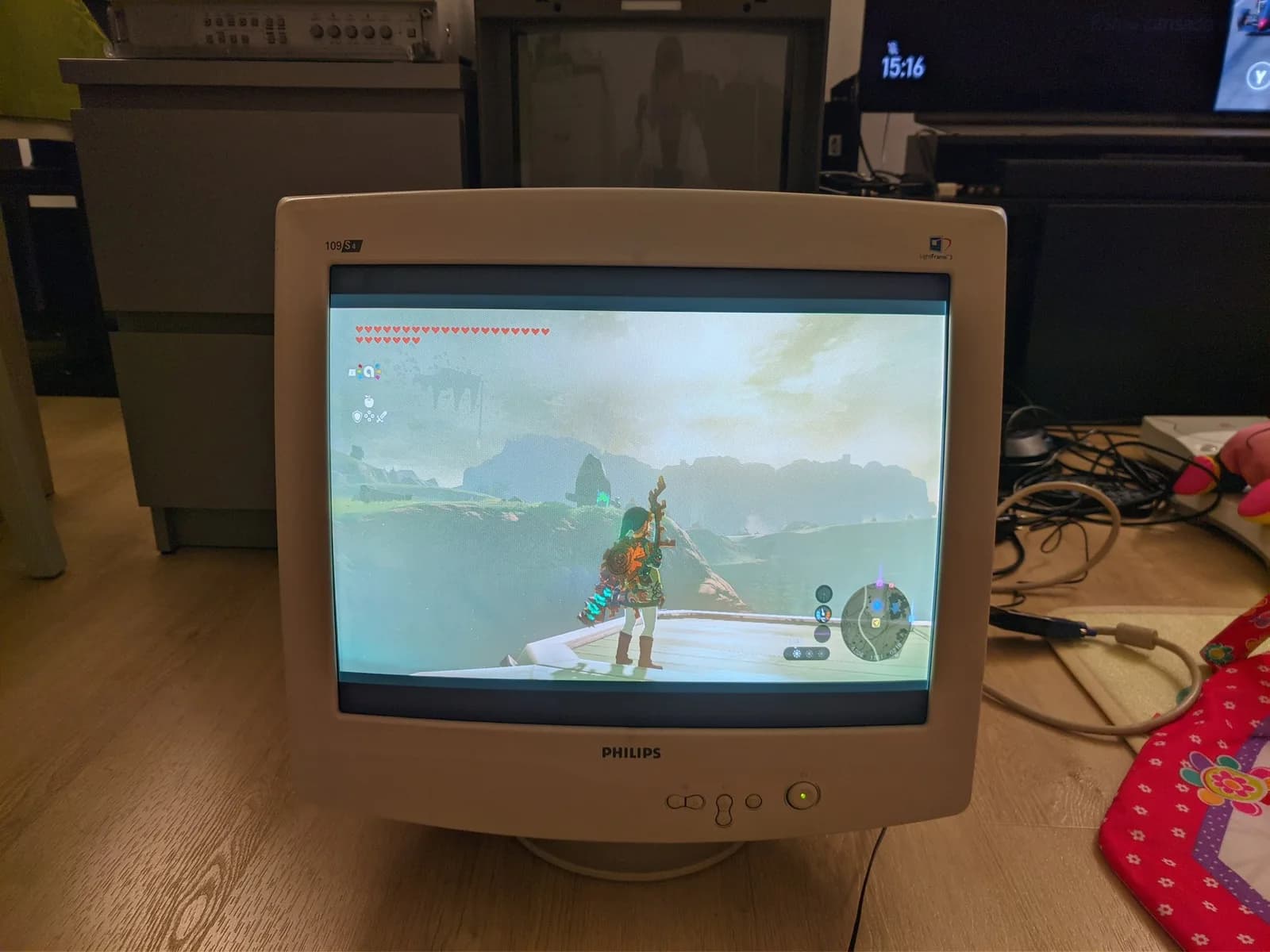 Philips 109S4 shadow-mask CRT running The Legend of Zelda: Tears of the Kingdom, with Link on screen, the picture rendered with the shadow mask's warm cast.