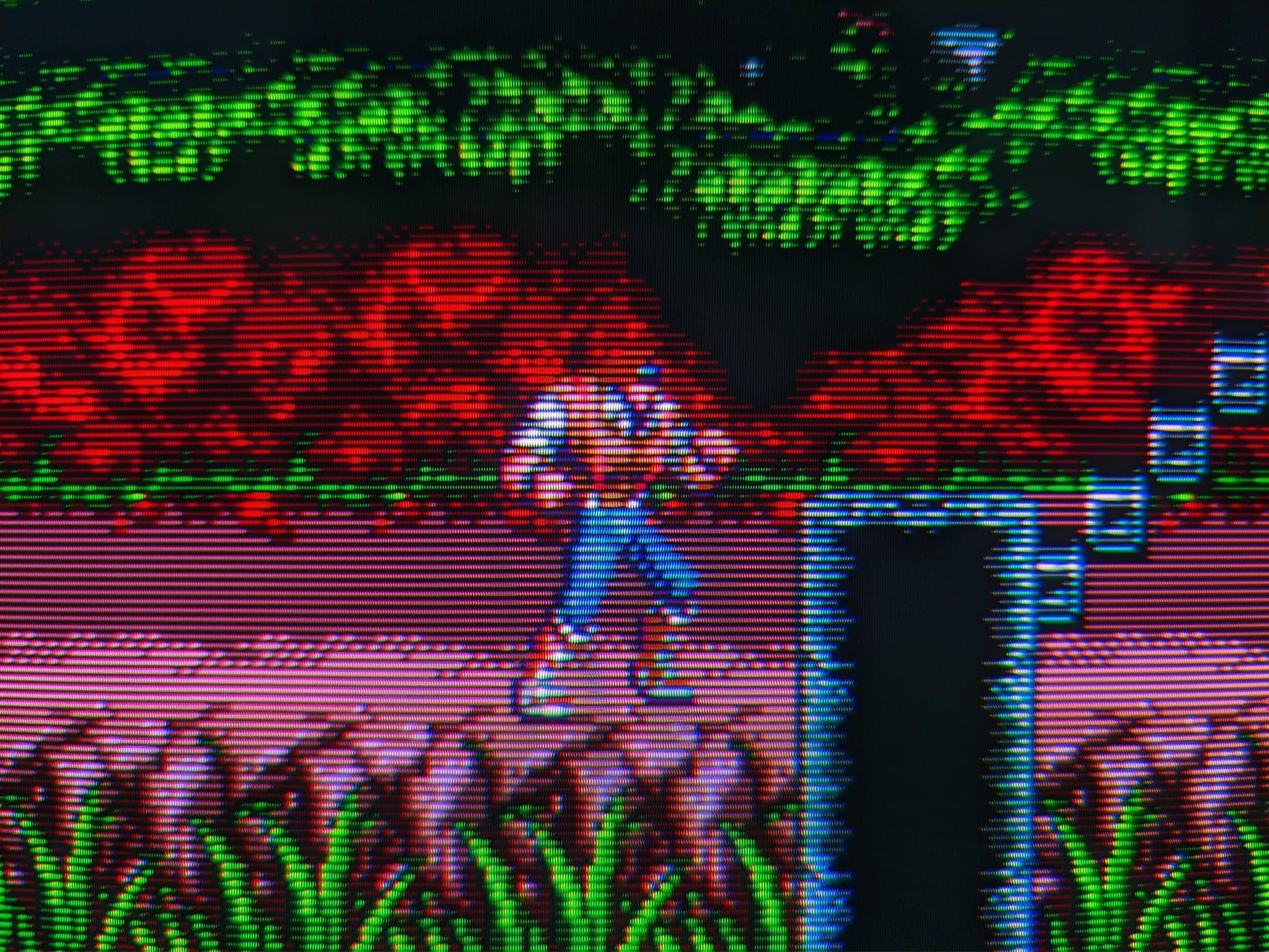 Sony PVM-14M4J displaying color bars test pattern with restored blue channel after reflowing tube connections; visible retrace lines remain.