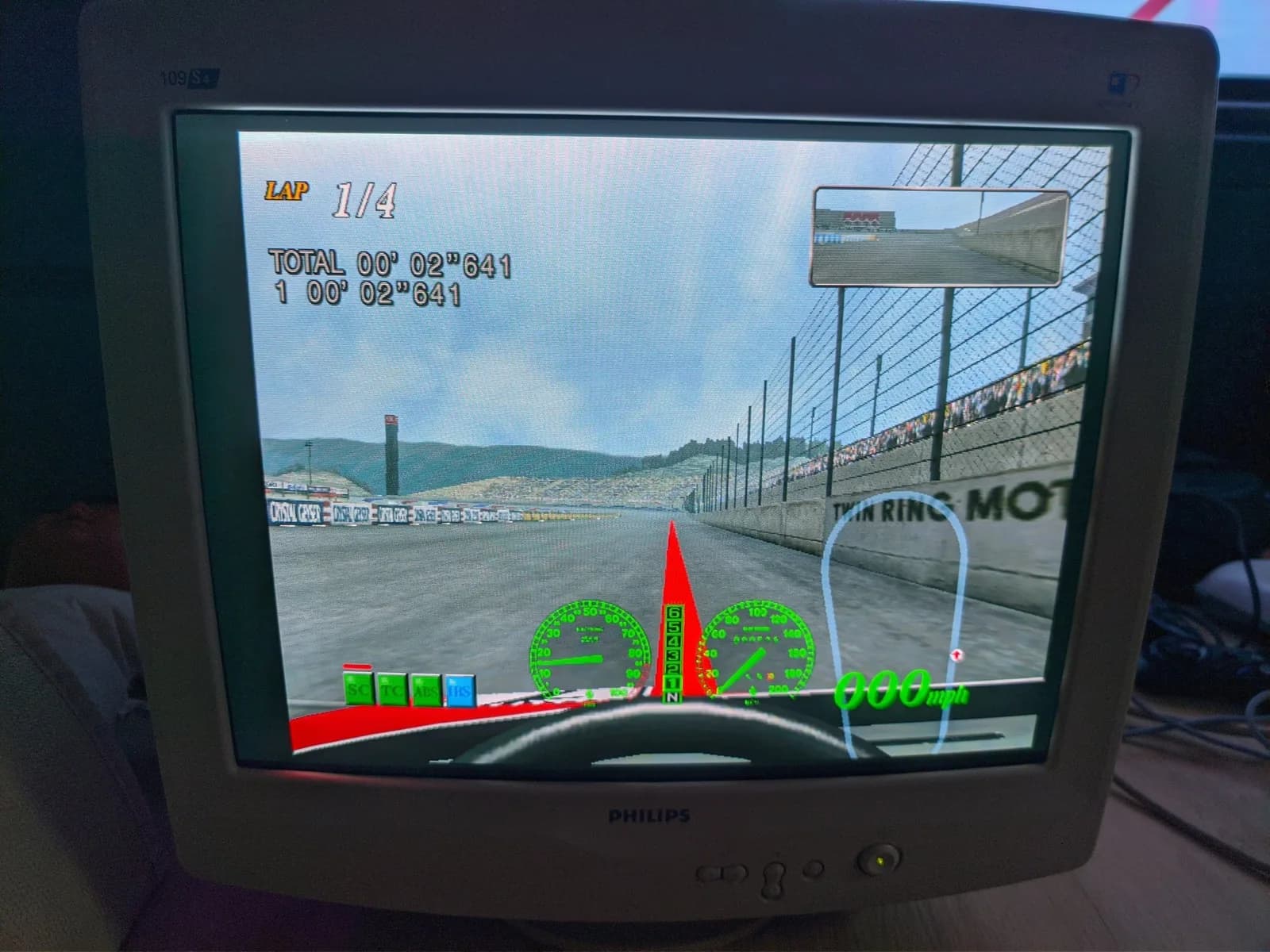 Philips 109S4 CRT running F355 Challenge on Dreamcast, cockpit view at Twin Ring Motegi with LAP 1/4, the speed and tacho gauges and a corner map.