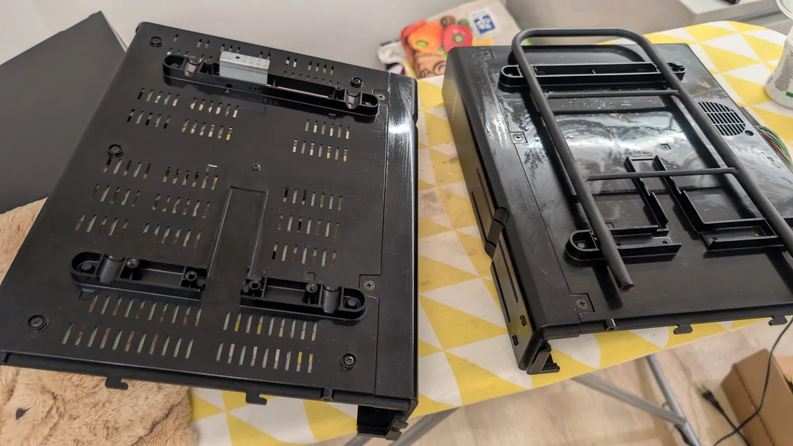 The plastic shrouds of the Sharp X68000's towers, their ventilation holes visible, the plastic gleaming after being cleaned.