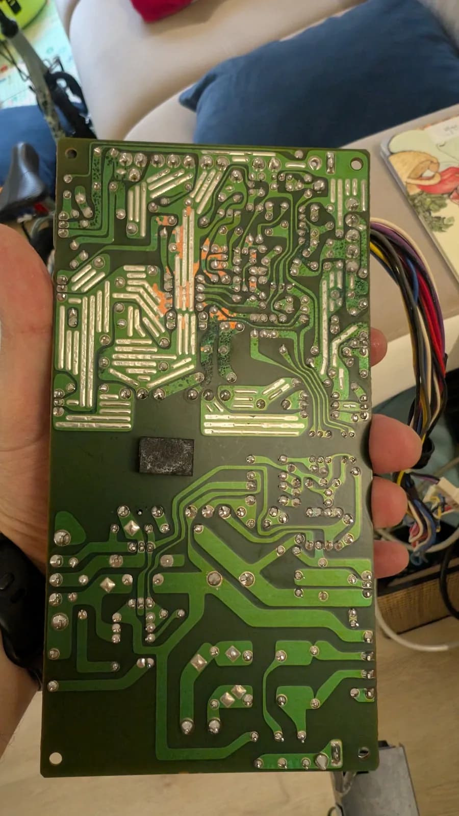 The Sharp X68000 PSU PCB after the ultrasonic cleaning, looking much better: some solder mask now gone exposing the copper traces, some still dark green from contamination, and the solder joints shiny where they were reflowed.