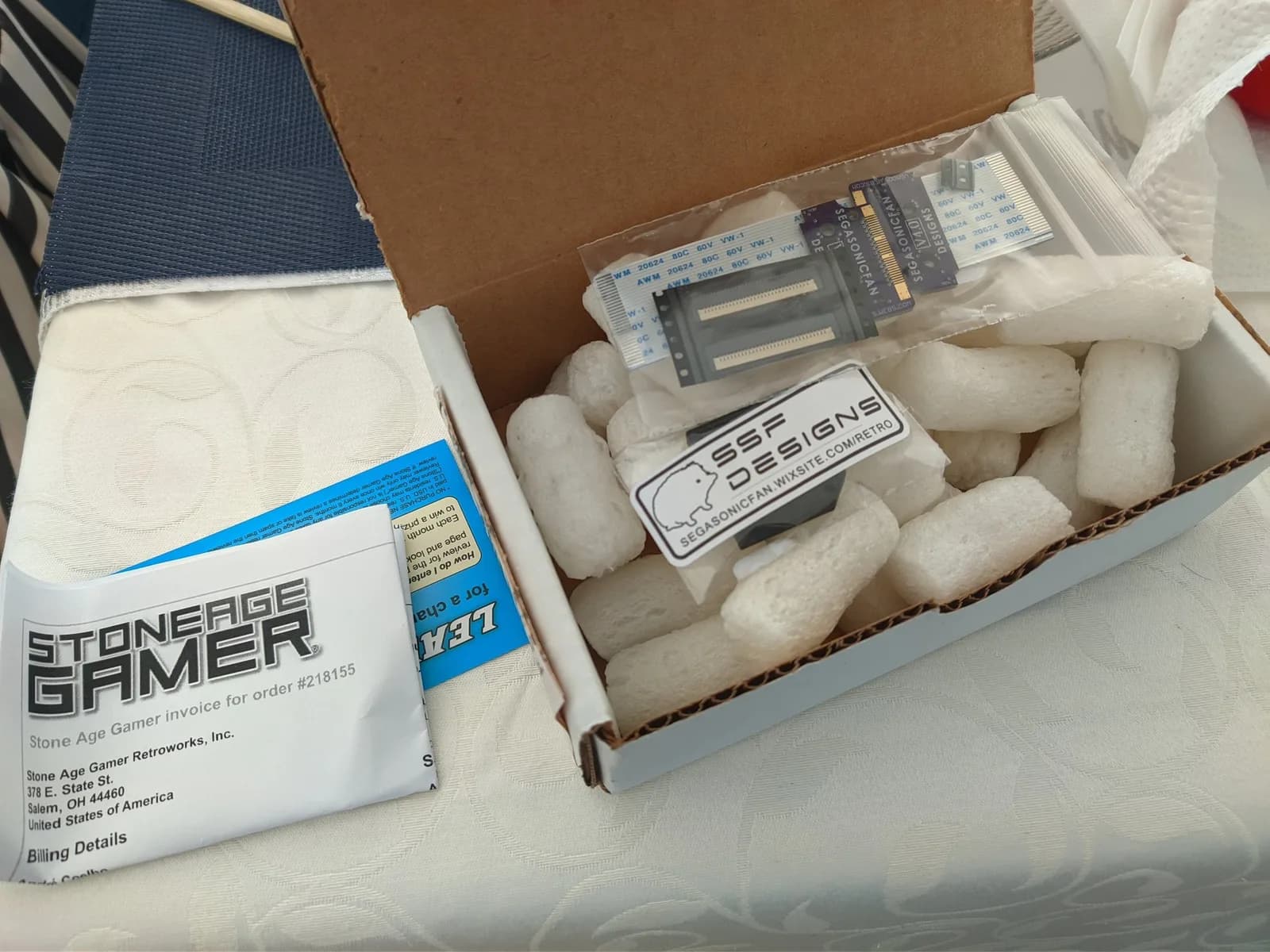 Virtual Ribbon 4.0 and repro stand from Stone Age Gamer, shipped with protective packaging and documentation for Virtual Boy refurbishment.