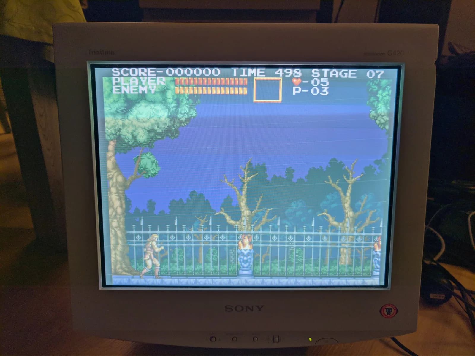 Castlevania Chronicles at Stage 07 on the Sony CPD-G420 during the geometry-fault diagnosis, a side-scrolling level with a gothic fence and bare trees.