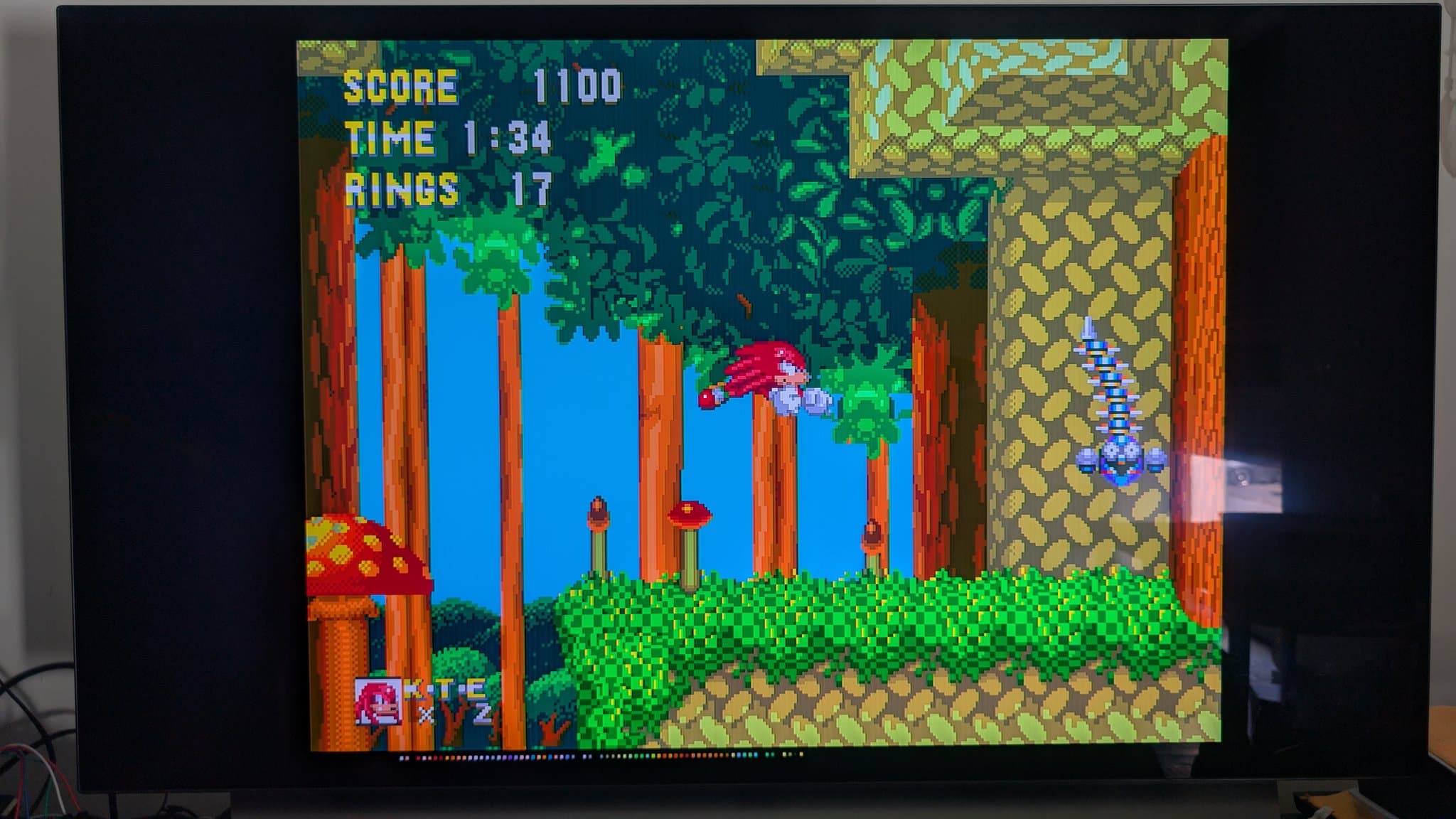 Sega Mega Drive running Sonic the Hedgehog 2, displaying score 11100, time 1:34, rings 17 during post-repair test run.