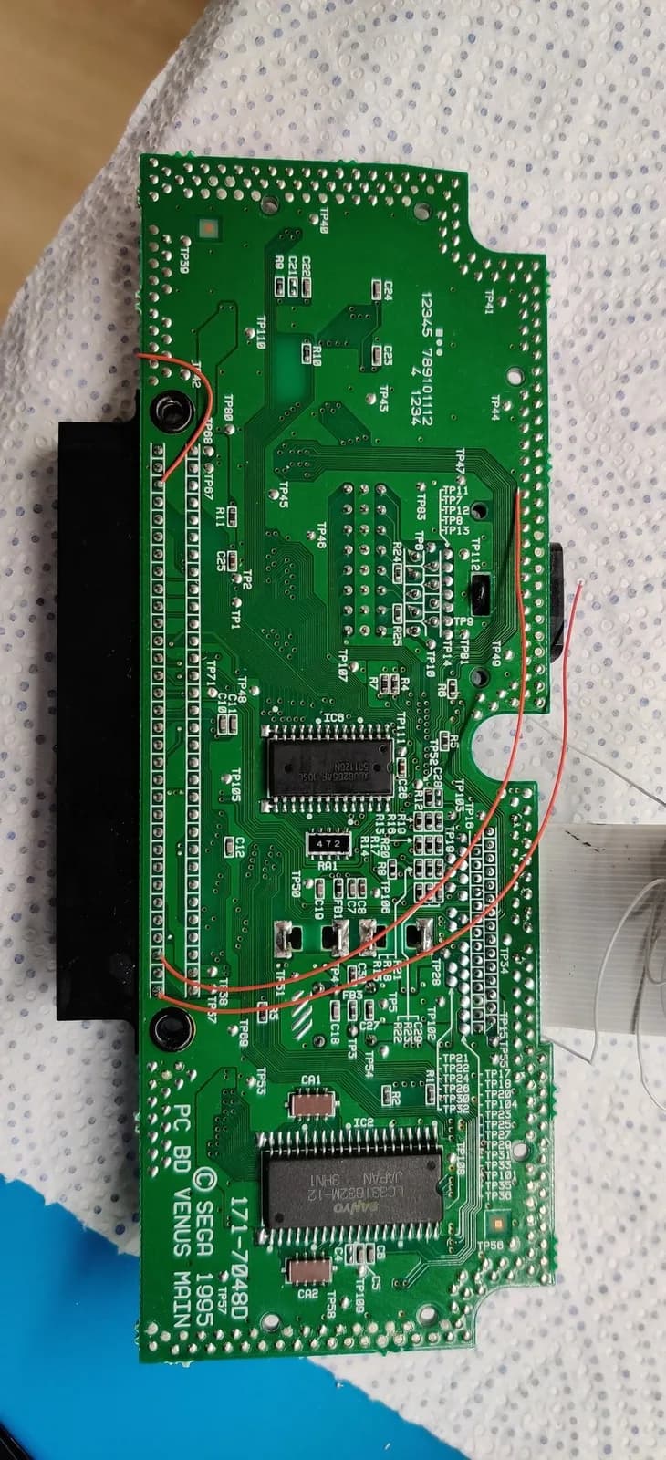 Sega Nomad PCB showing audio restoration mod with 10uF capacitors and 10k resistors soldered for Master System and Mega-CD audio channels.