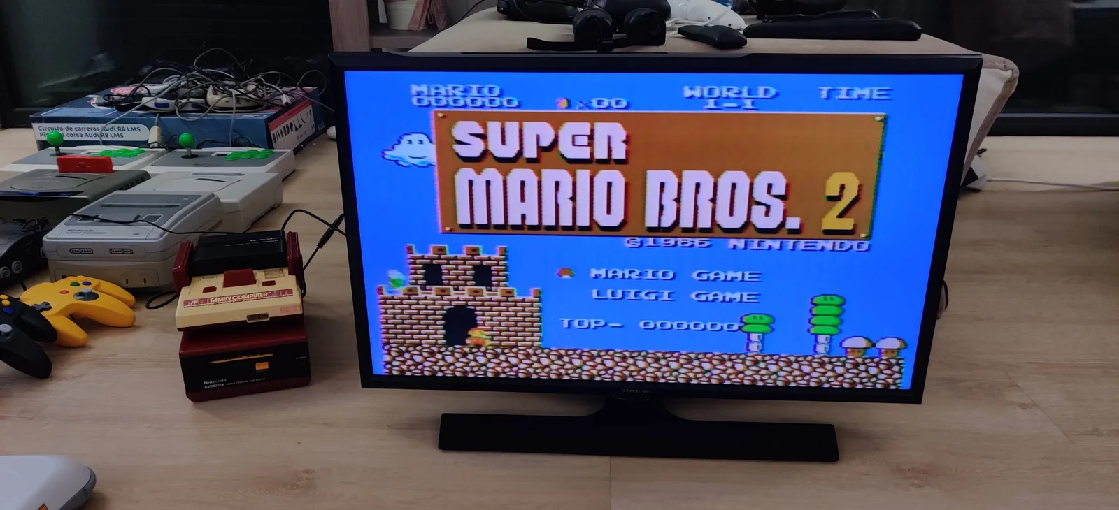 Nintendo Famicom Disk System displaying Super Mario Bros. 2 title screen after belt replacement and head alignment repair.