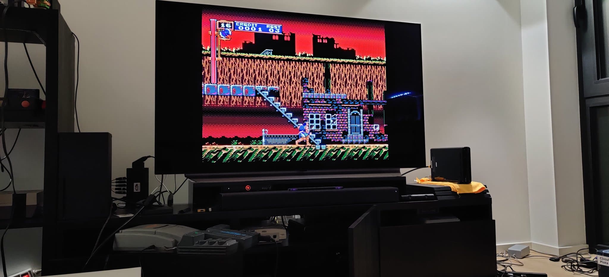 NEC PC Engine Super CD-ROM2 displaying Castlevania: Rondo of Blood on a TV, the console on a black stand. The 8-pin DIN and RGB amp mods are not visible in this shot but are what is being tested.
