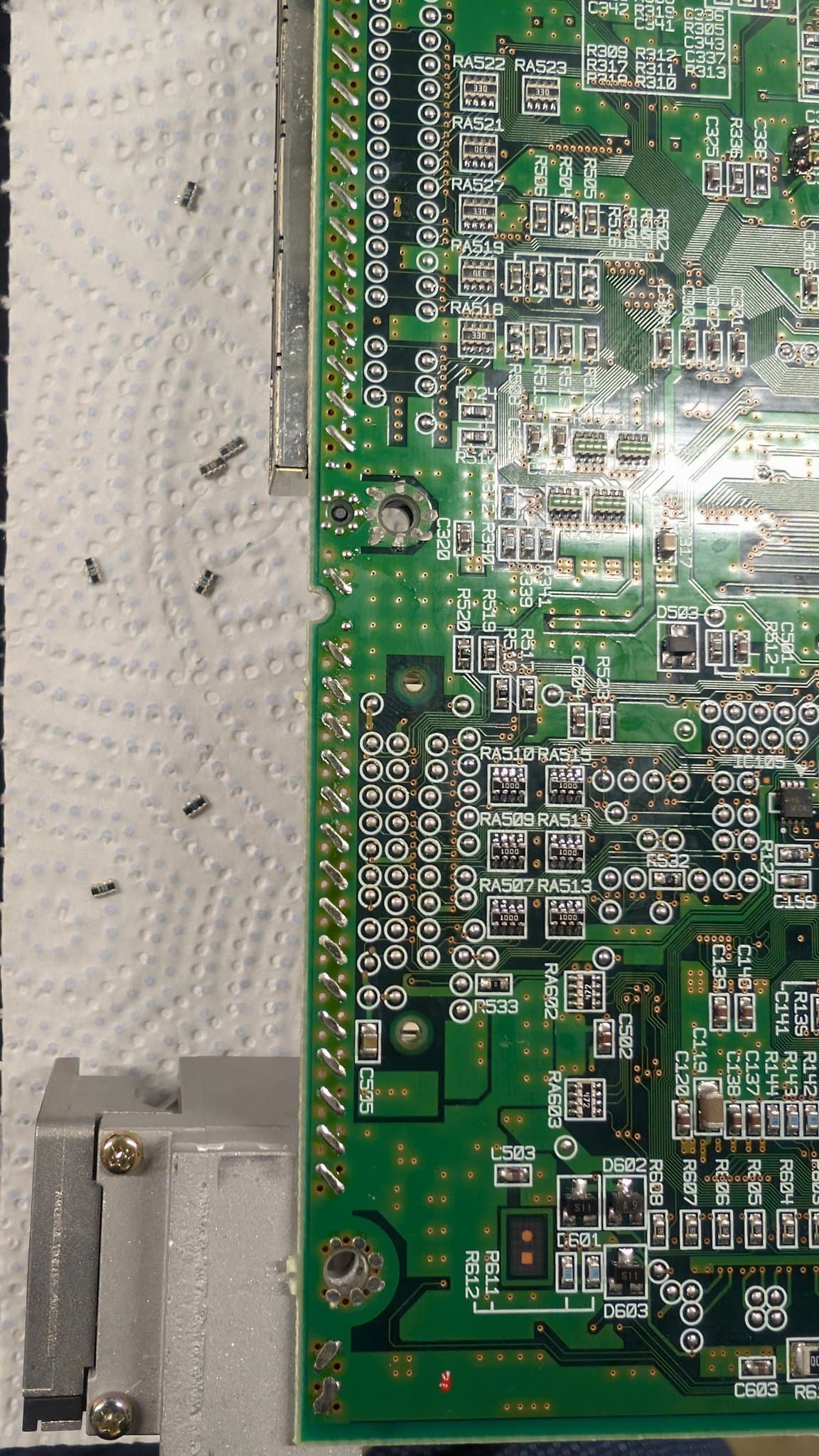 Close-up of the Dreamcast VA0 motherboard's resistor-array section, where the 5V to 3.3V logic-level mod is done so a GDEMU optical-drive emulator will run on a VA0 board.