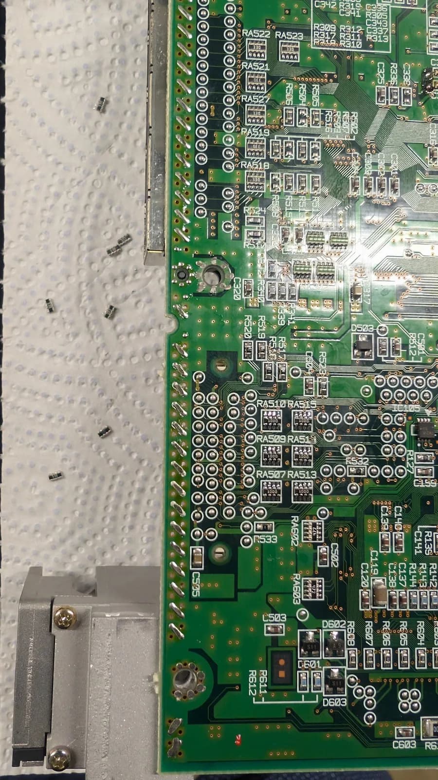 Close-up of the Dreamcast VA0 motherboard's resistor-array section, where the 5V to 3.3V logic-level mod is done so a GDEMU optical-drive emulator will run on a VA0 board.