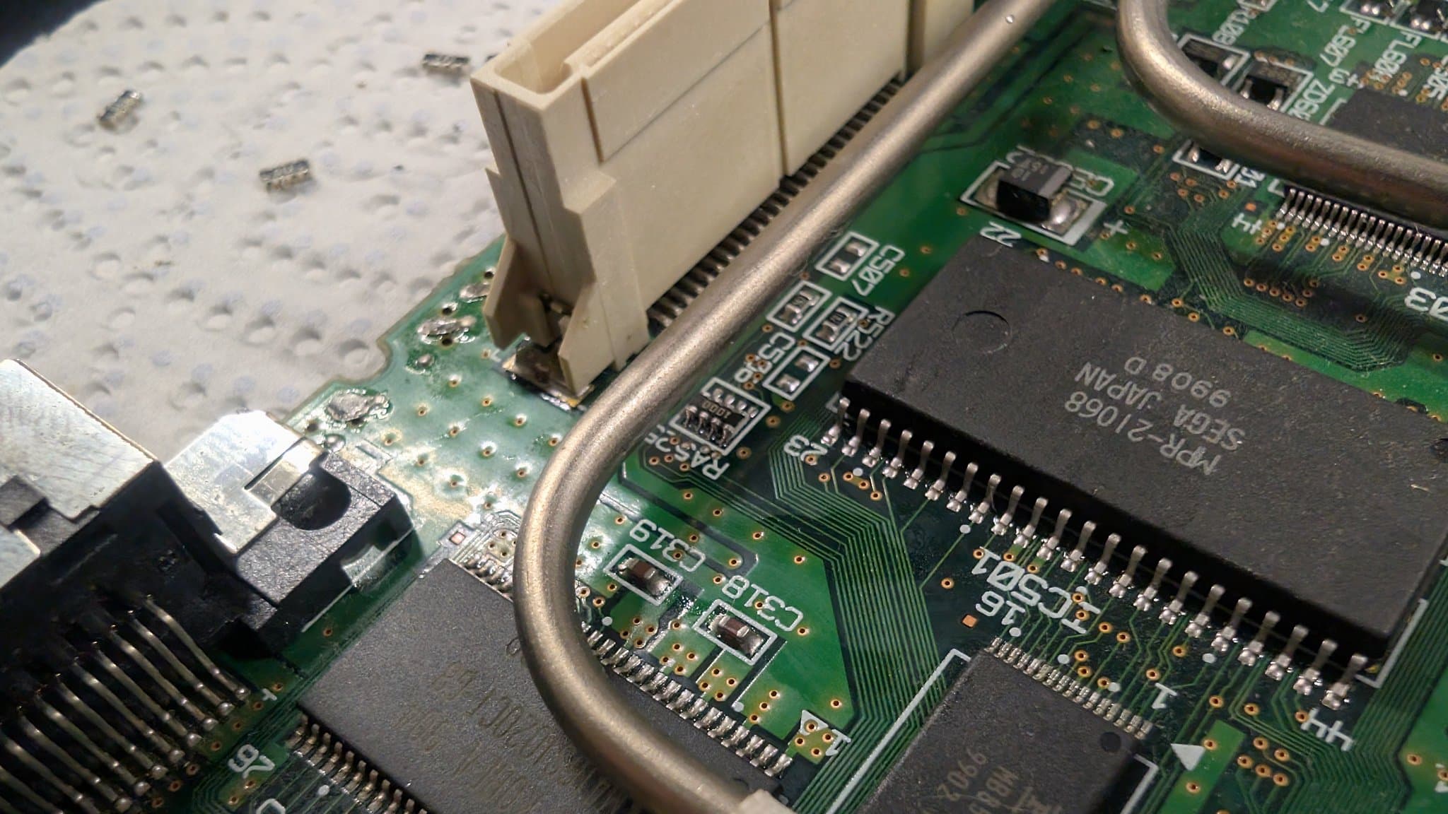 Close-up of the Dreamcast VA0 motherboard by the GD-ROM connector, with resistors added across the data lines for the 5V to 3.3V level mod that a VA0 needs before GDEMU will work.