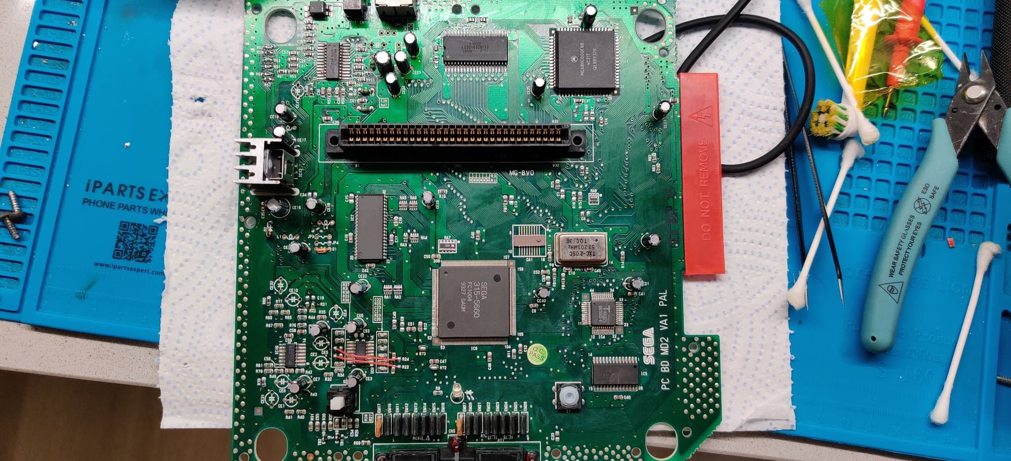 Mega Drive II mainboard with 3BP triple bypass mod installation in progress, showing solder joints and wiring connections on VA1 PCB.