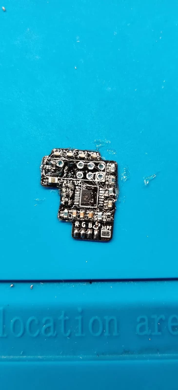 The N64 RGB amp PCB with all its SMD components placed and coated in flux, ready for a hot-air reflow to solder them down. The video IC is the only part not yet on the board.