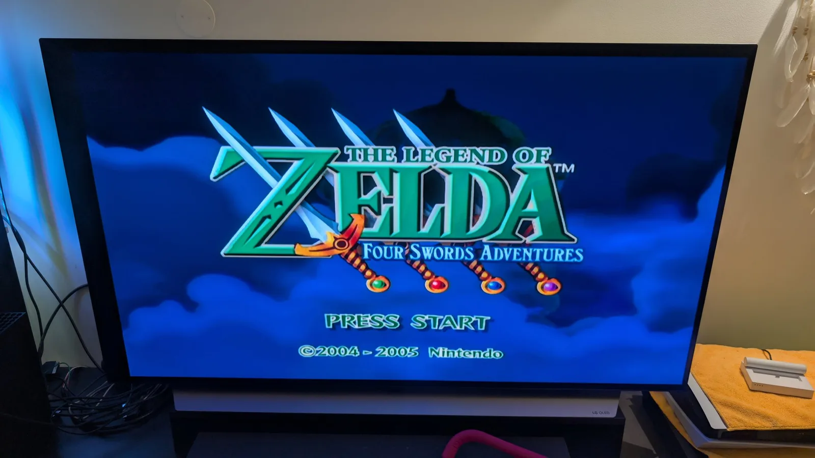 The Legend of Zelda: Four Swords Adventures title screen on an LG OLED TV, testing the spice orange GameCube after the FlippyDrive install.