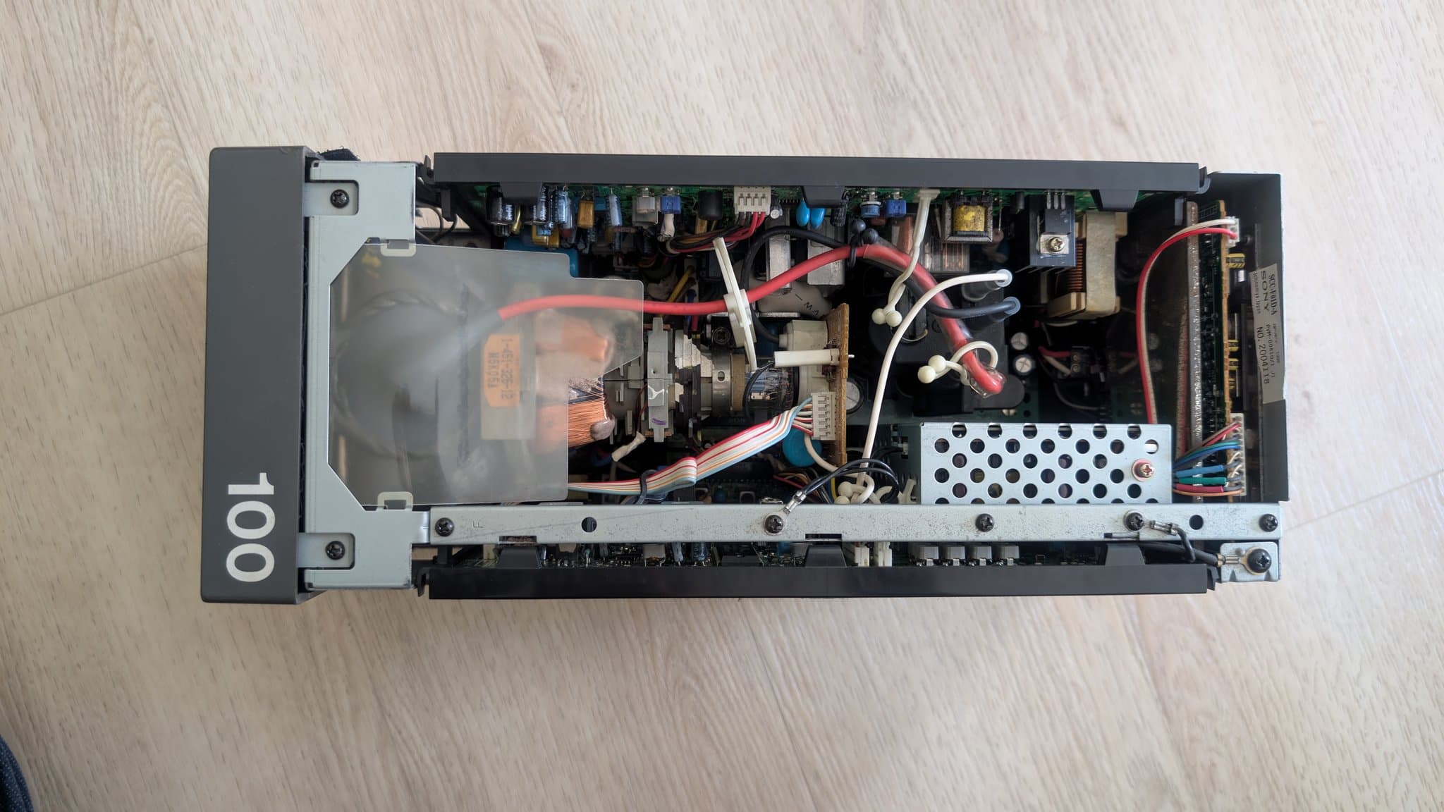 Interior of Sony PVM-6041Q after cleaning; transformer, capacitors, wiring, and power supply components visible.
