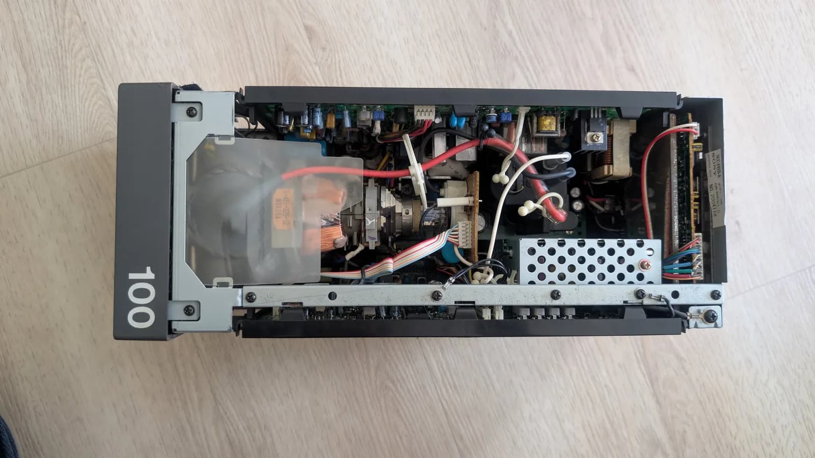 Interior of Sony PVM-6041Q after cleaning; transformer, capacitors, wiring, and power supply components visible.