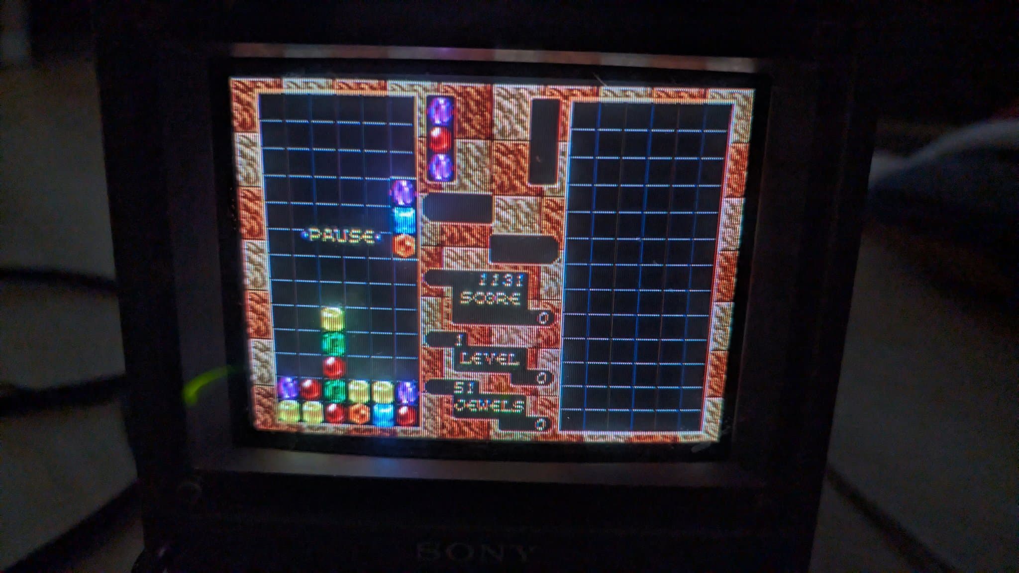 Sony PVM-6041Q displaying Columns gameplay via Wondermega composite output; pause menu visible with score and level info.