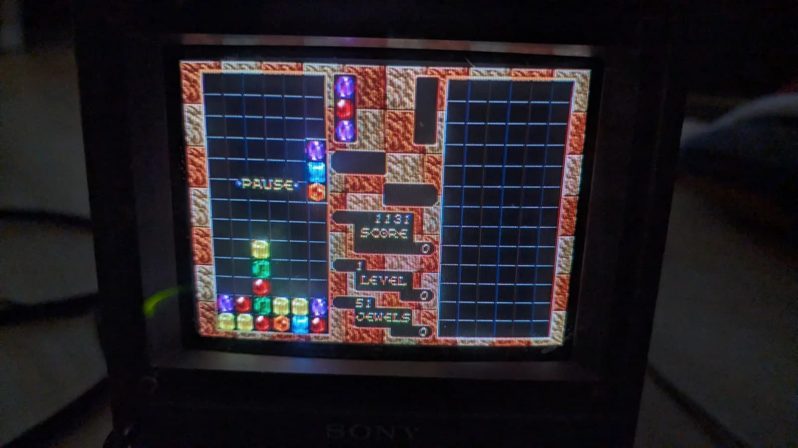 Sony PVM-6041Q displaying Columns gameplay via Wondermega composite output; pause menu visible with score and level info.