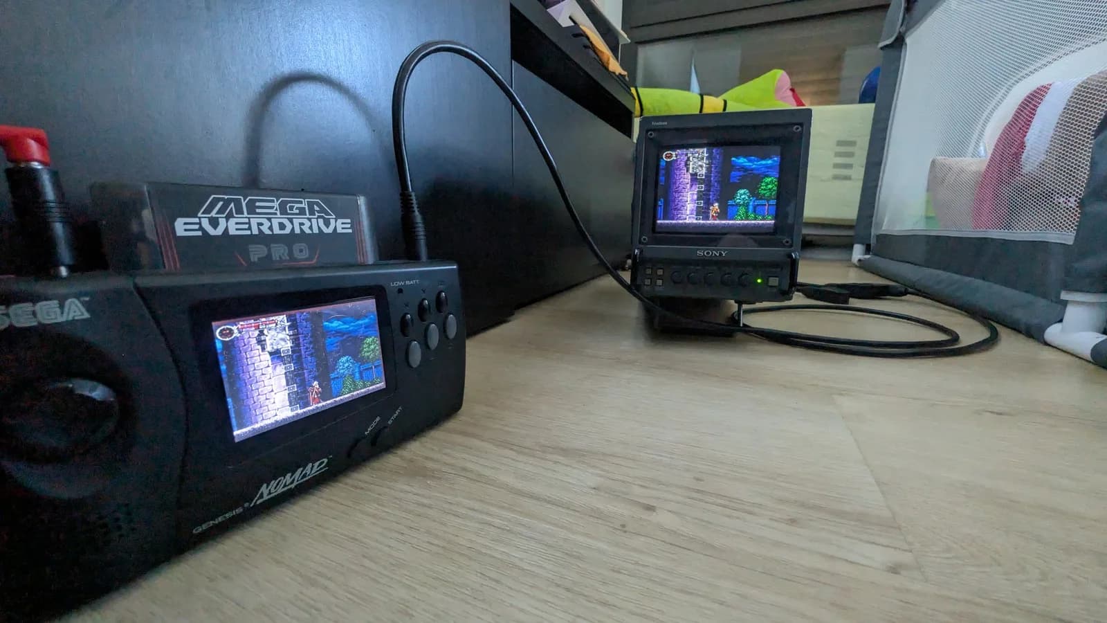 Sony PVM-6041Q displaying Castlevania, connected via SCART to BNC cable, vertical hold adjusted, next to Mega Everdrive Pro test setup.