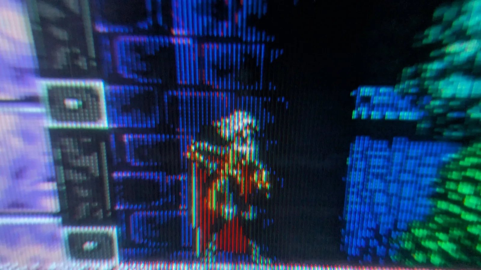 Sony PVM-6041Q CRT displaying colorful test pattern with vertical scanlines; small professional monitor showing restored picture quality after repair.