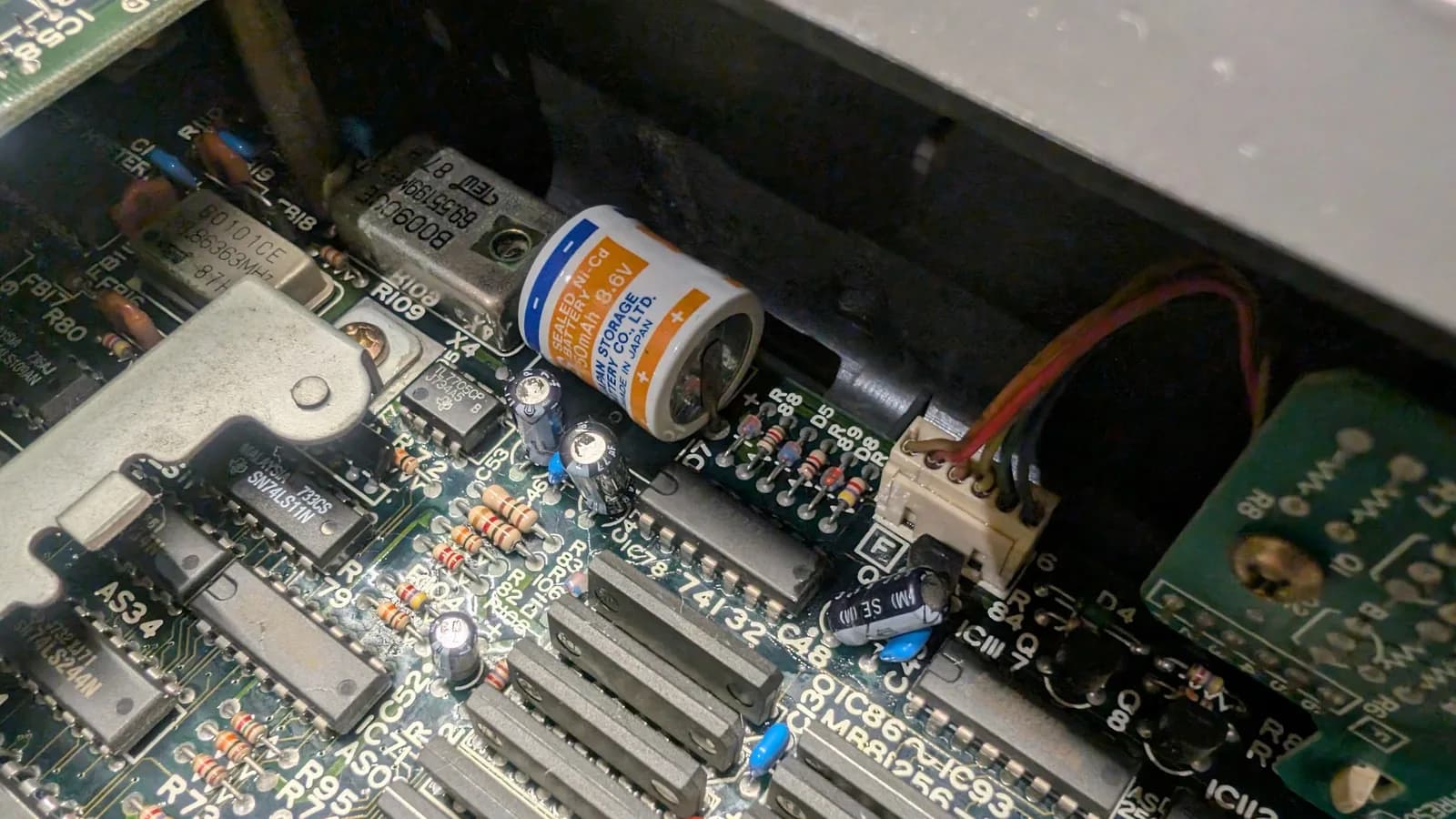 The same area of the Sharp X68000 main board after cleaning with vinegar and isopropyl alcohol, the green corrosion now gone.