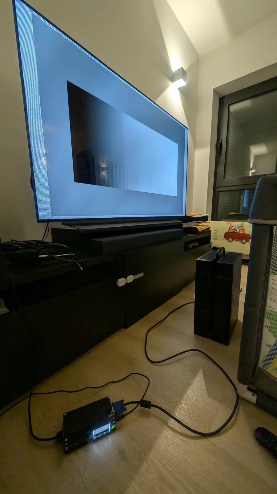 The Sharp X68000 connected through the VGA adapter and OSSC to a TV, which is blank apart from the OSSC's typical no-input pattern, since no signal is coming from the computer.