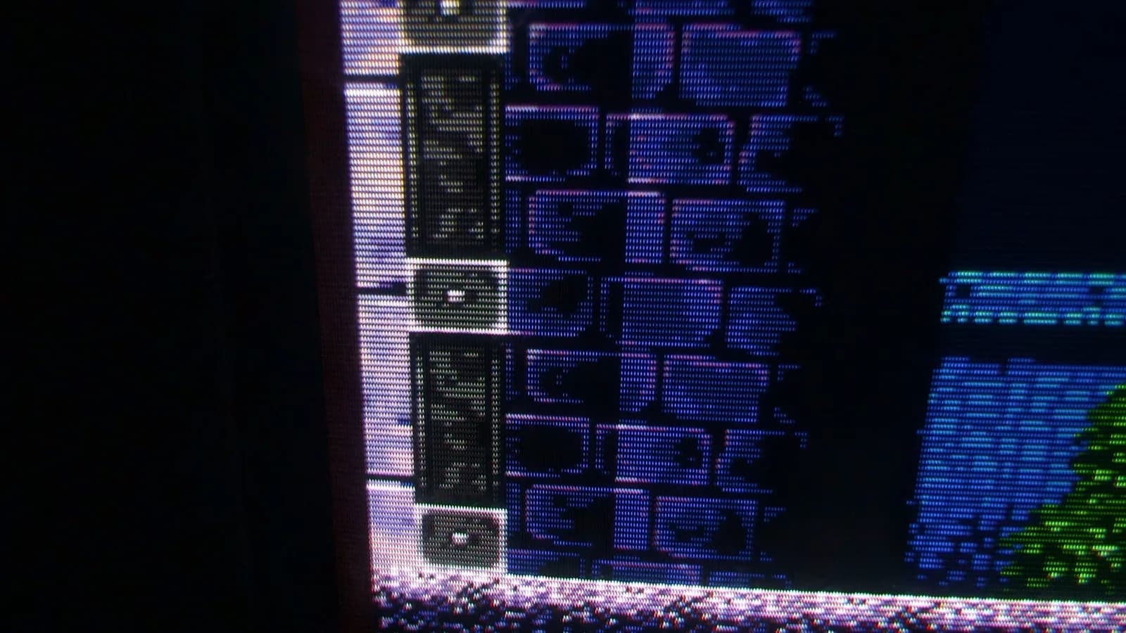 Sony PVM-9045QD showing the Mega Drive homebrew demake of Castlevania: Symphony of the Night, a macro close-up of the castle wall and gate, the CRT phosphor structure visible.