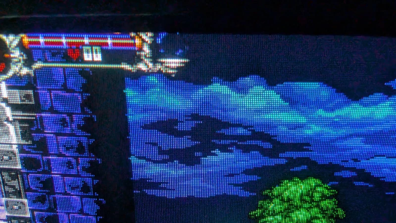 Sony PVM-9041Q showing the Mega Drive homebrew demake of Castlevania: Symphony of the Night, a close-up of the HP bar, sky, castle wall and green tree foliage.