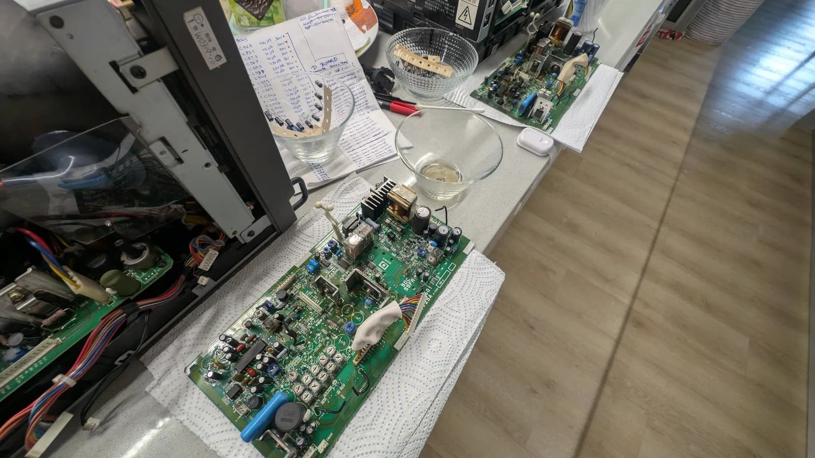 A depopulated 9-inch PVM deflection board after cleaning with white vinegar and isopropyl, not yet recapped, some vinegar still in the bowl to the side.