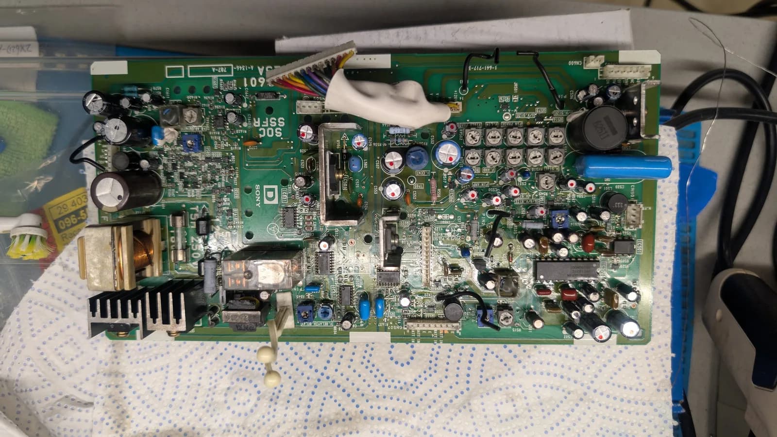 The same Sony PVM-9045QD deflection board from the top, every replaced capacitor marked with a red dot.