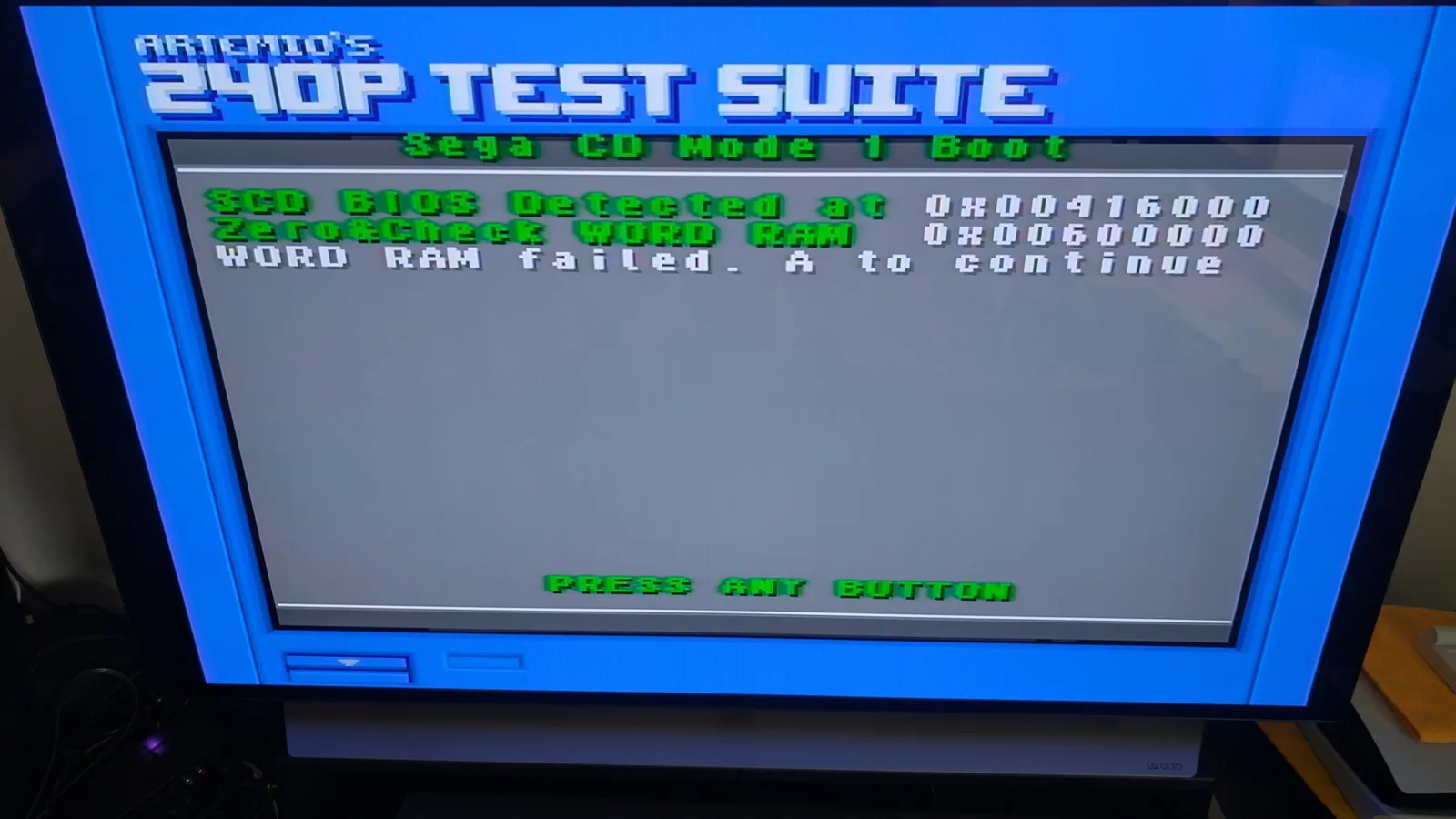 Artemio's 240p Test Suite showing SEGA CD Mode 1 boot screen with SEGA CBUS detected and Word RAM failed error message on blue CRT.