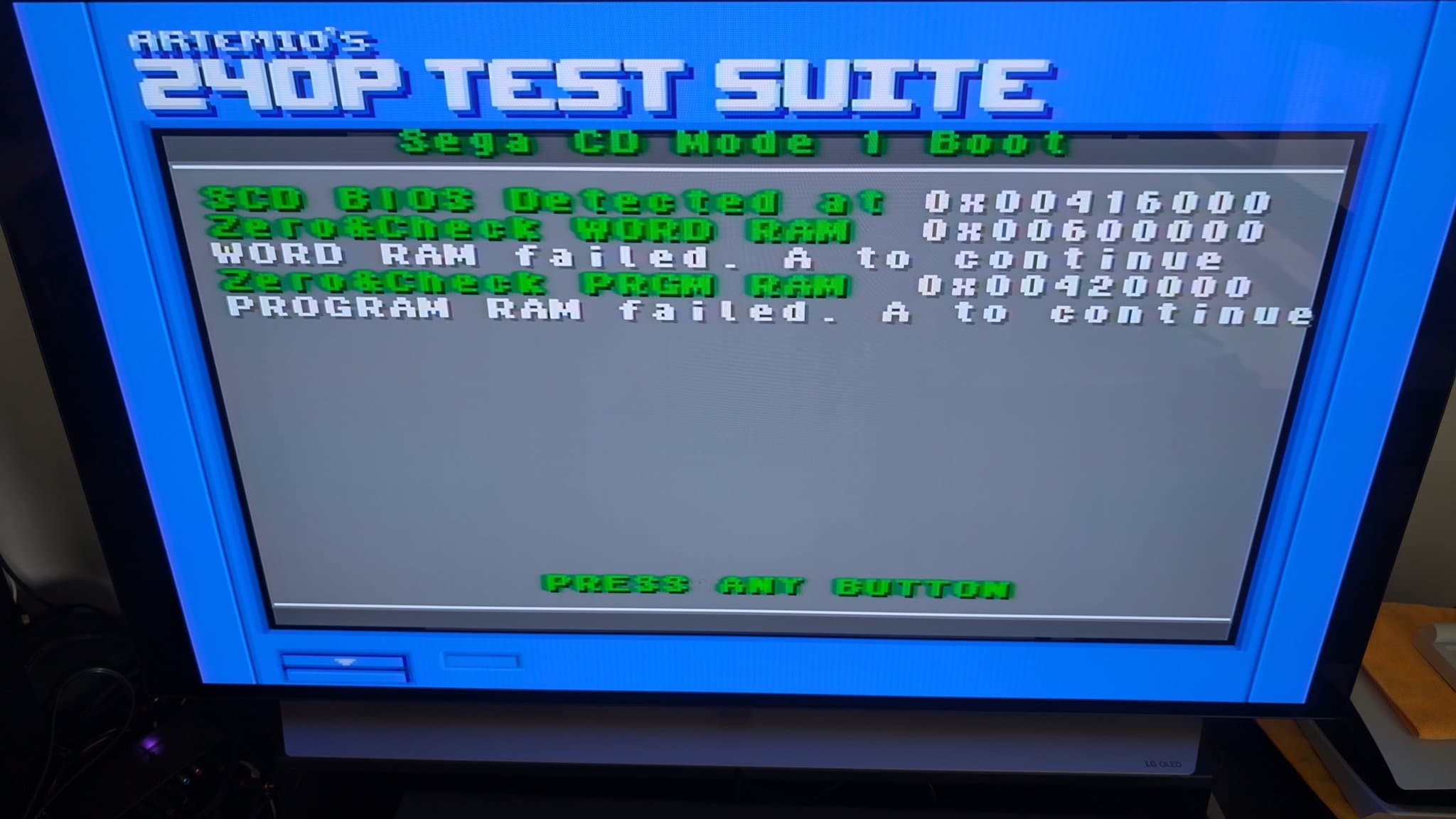 Sega 240P test suite displaying RAM failures: Word RAM and Program RAM errors with hex addresses on blue CRT screen.