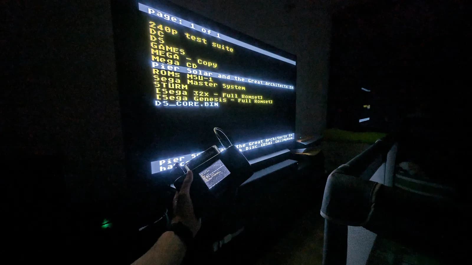Wondermega diagnostic menu displayed on CRT monitor showing Z80P test suite and ROM options; controller held in foreground during testing.