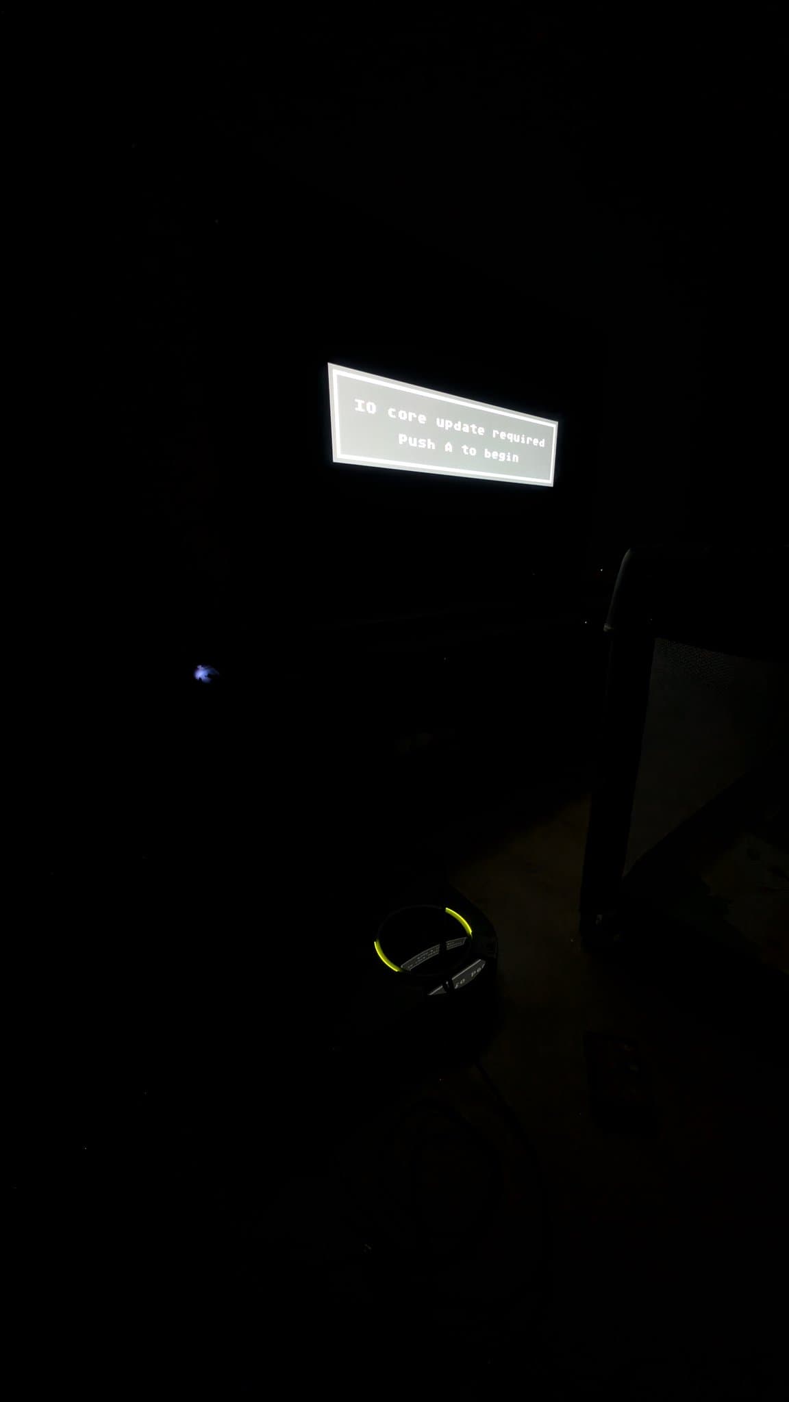Wondermega displaying "IO core update required Push A to begin" error message on CRT screen during Mega ED Pro firmware testing.
