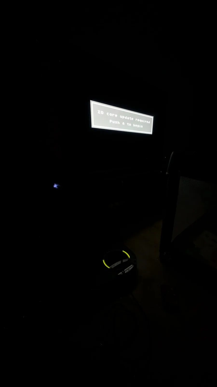 Wondermega displaying "IO core update required Push A to begin" error message on CRT screen during Mega ED Pro firmware testing.