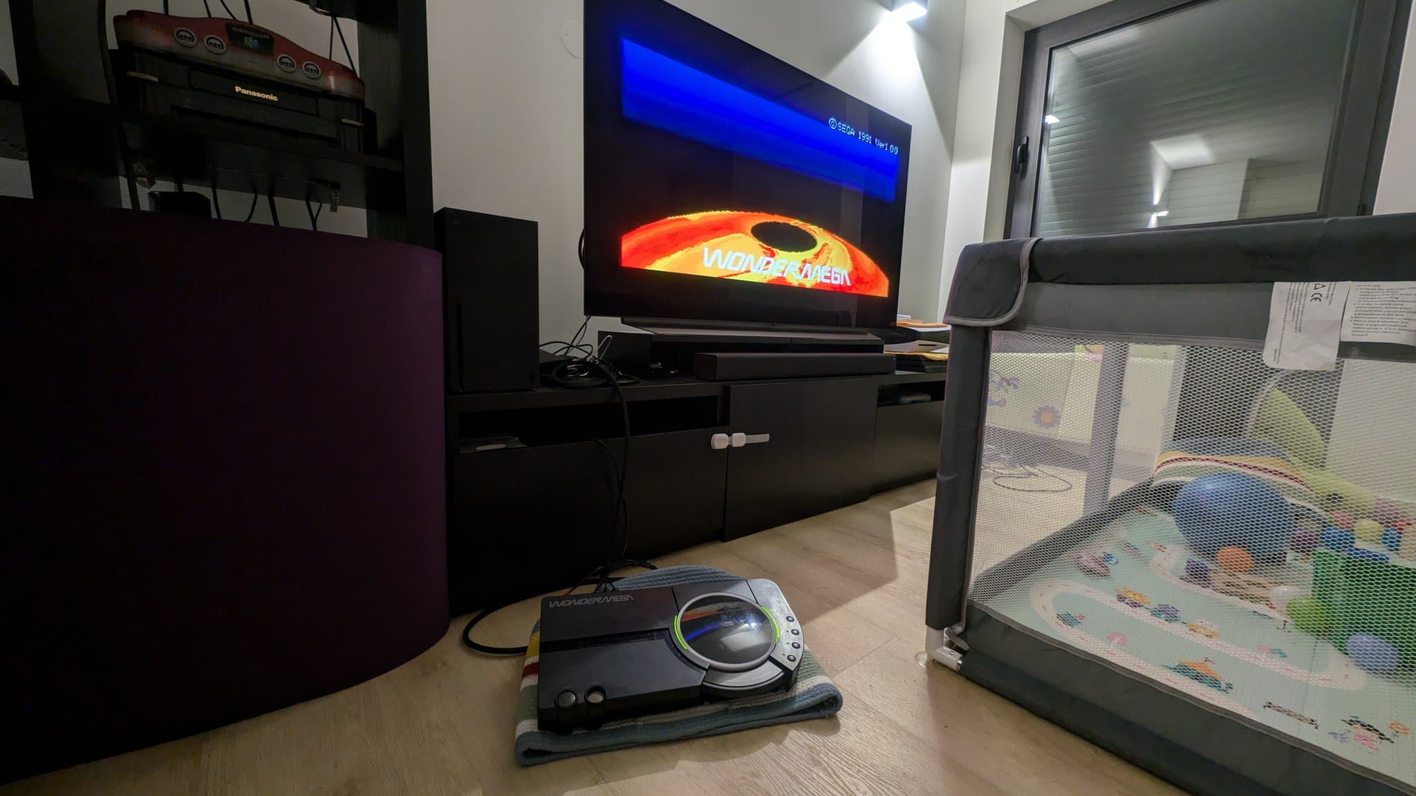 Sega Wondermega displaying startup freeze screen with internal cable connected, showing repair progress on restored console.