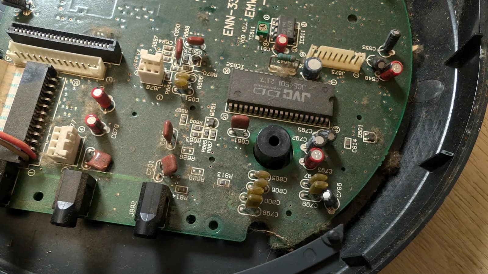 Wondermega main board showing corrosion damage, missing components, broken traces, and deteriorated solder joints requiring restoration work.