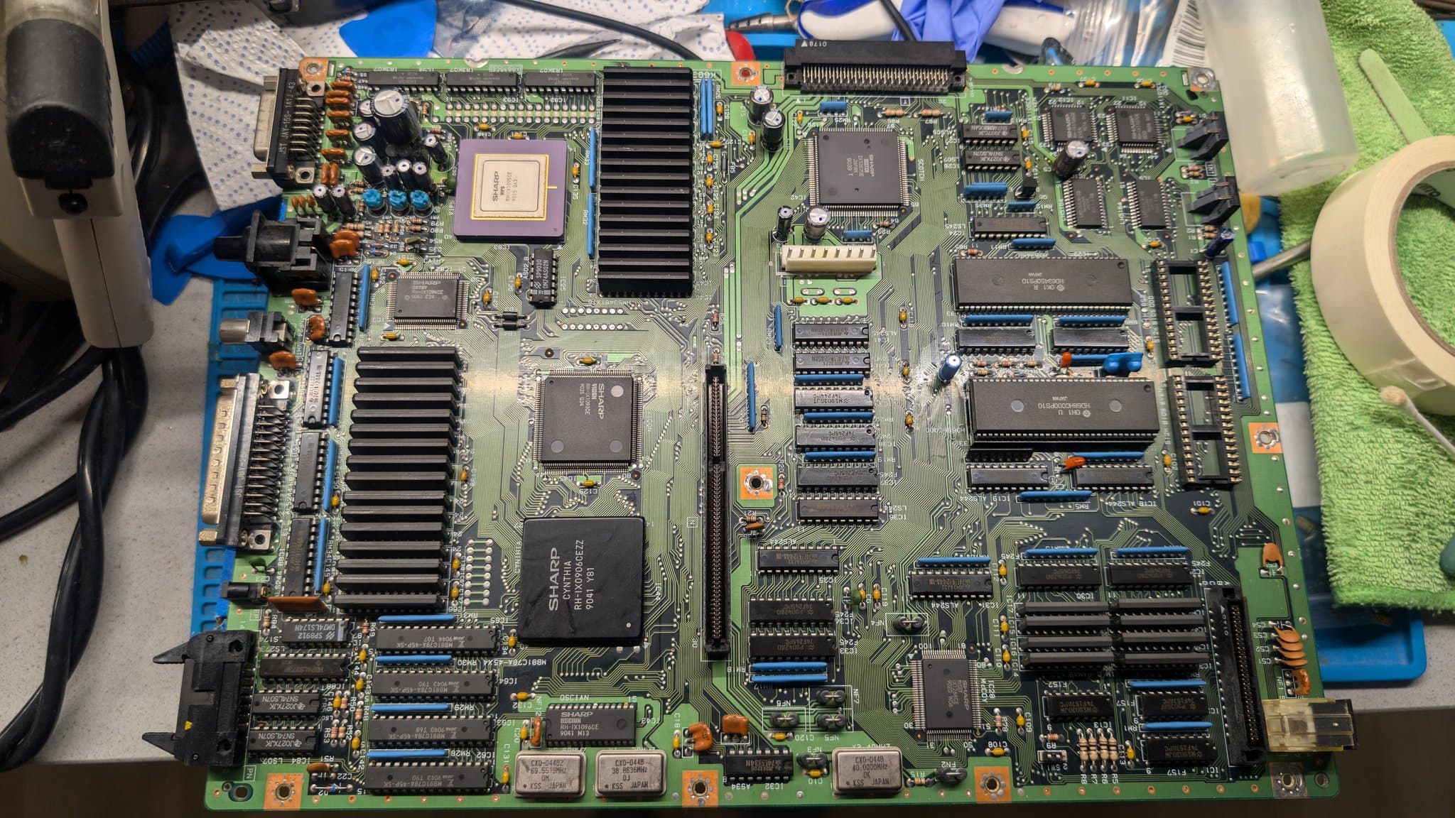 The Sharp X68000 Pro II mainboard with its ICs and connector strips during a partial recap aimed at restoring the lost video output.
