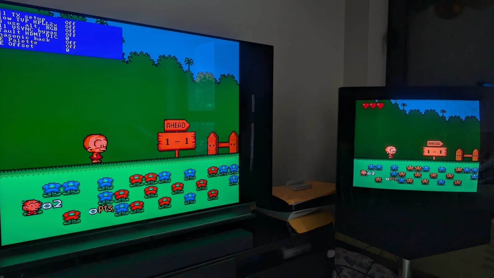 The same PC Engine Bonk level on two displays, comparing the OSSC's experimental composite-palette emulation: a larger flat-panel TV on the left running the OSSC (RGB, with its settings menu overlaid), and a smaller CRT on the right showing the CoreGrafx's direct composite output.