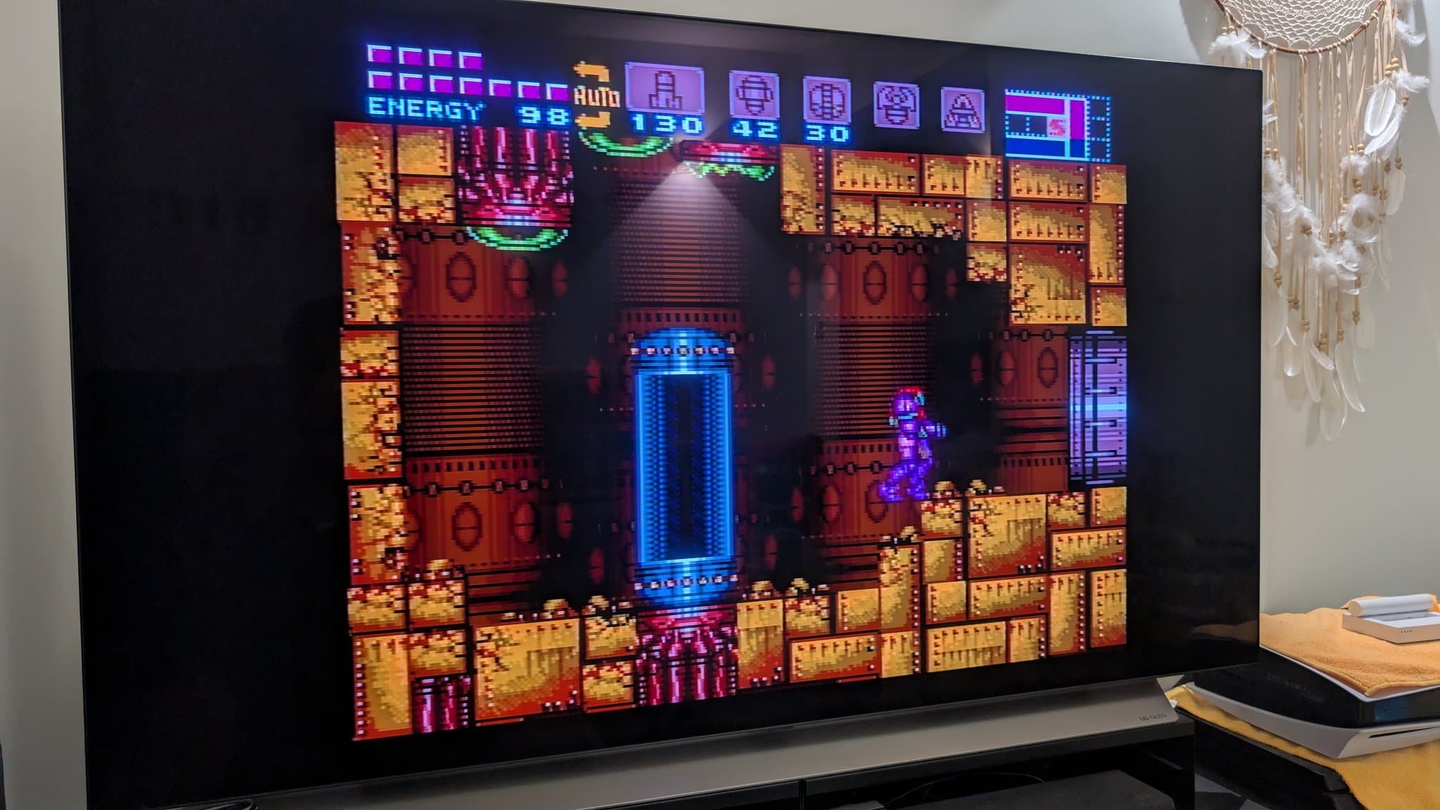 Super Metroid gameplay showing active cartridge with restored save file after battery and capacitor replacement maintenance.
