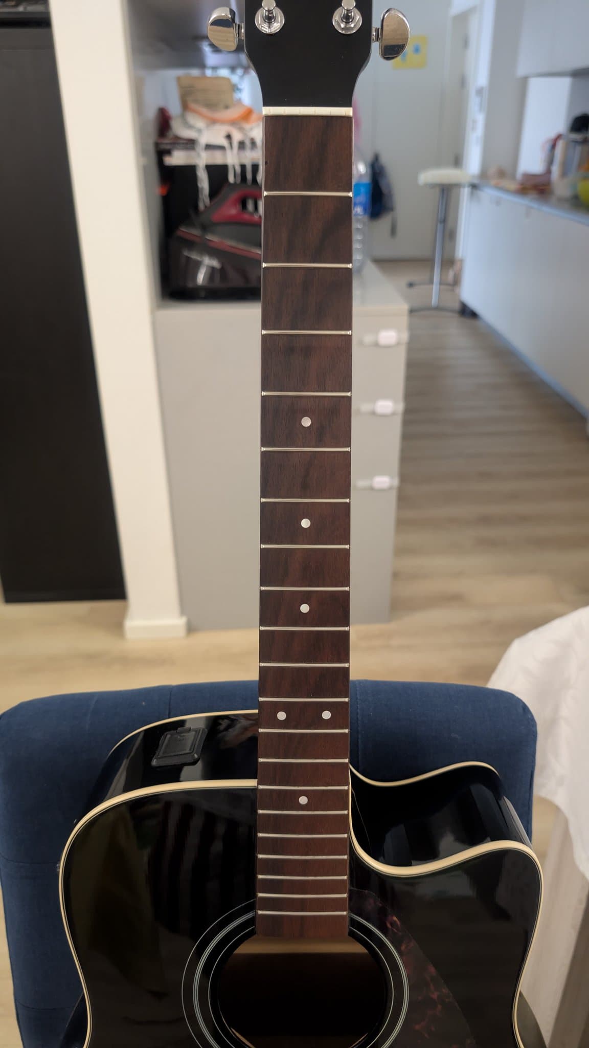 Yamaha FX370C acoustic guitar neck and fretboard after lemon oil cleaning, showing restored rosewood fretboard with frets and inlays.
