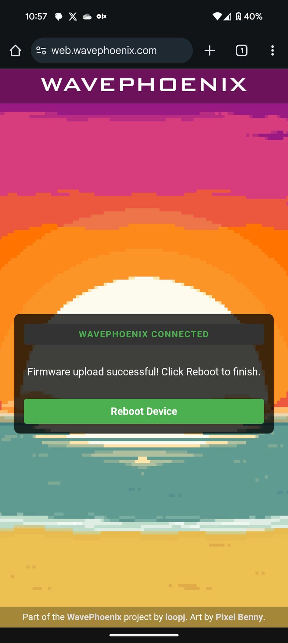 WavePhoenix firmware upload success screen showing "WAVEPHOENIX CONNECTED" message with green "Reboot Device" button on colorful pixelated background.