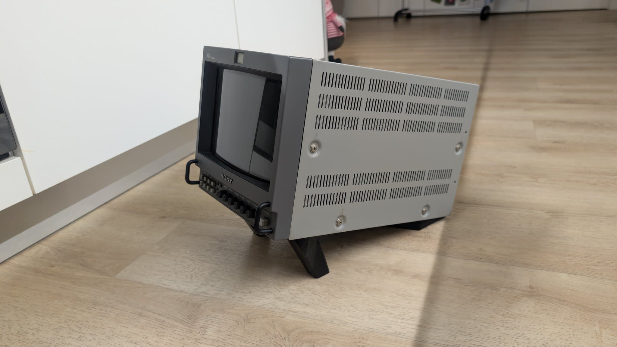 Sony PVM-9045QD on 3D-printed monitor stand, displaying restored unit after PSU, neck board, and deflection board repairs.