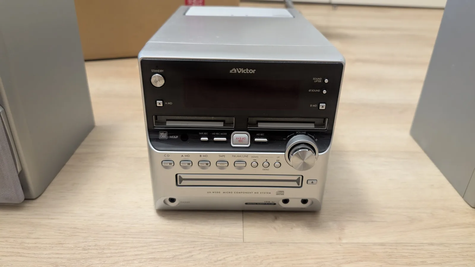 Victor UA-W888 MiniDisc micro component stereo system with dual cassette, CD, and MD decks on wooden surface.