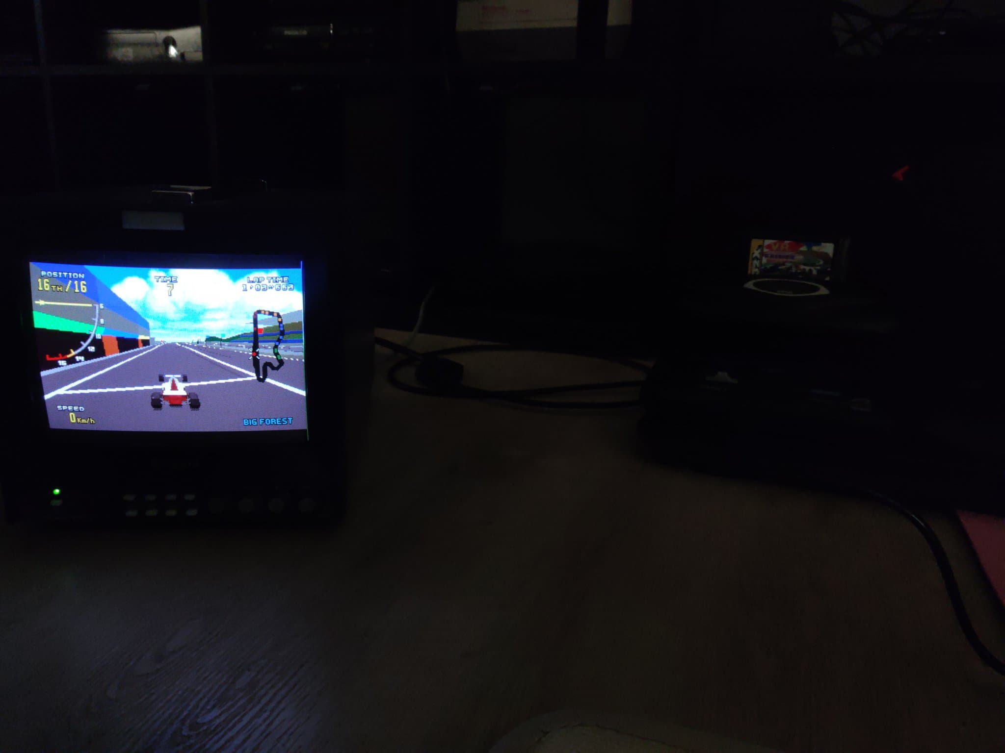 Sega 32X Virtua Racing Deluxe displaying gameplay on CRT monitor after capacitor replacement and cleaning repair.