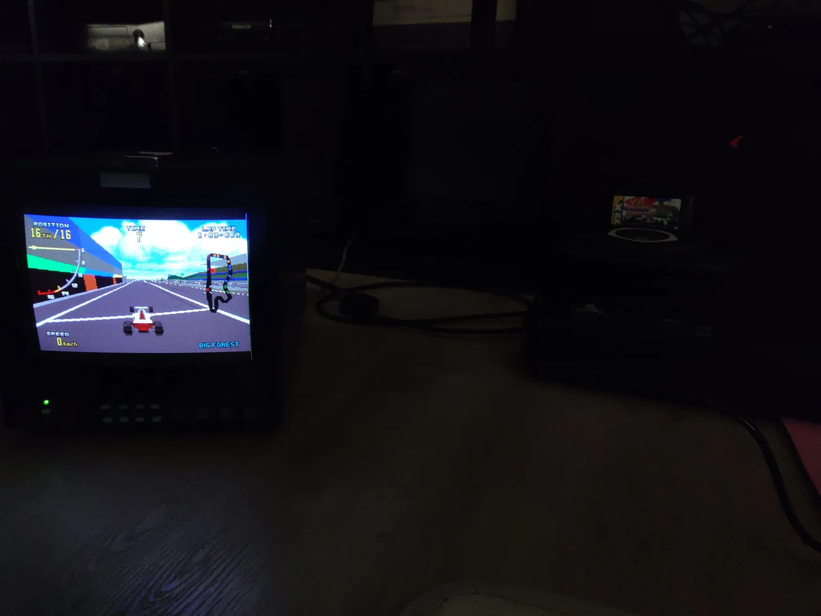 Sega 32X Virtua Racing Deluxe displaying gameplay on CRT monitor after capacitor replacement and cleaning repair.