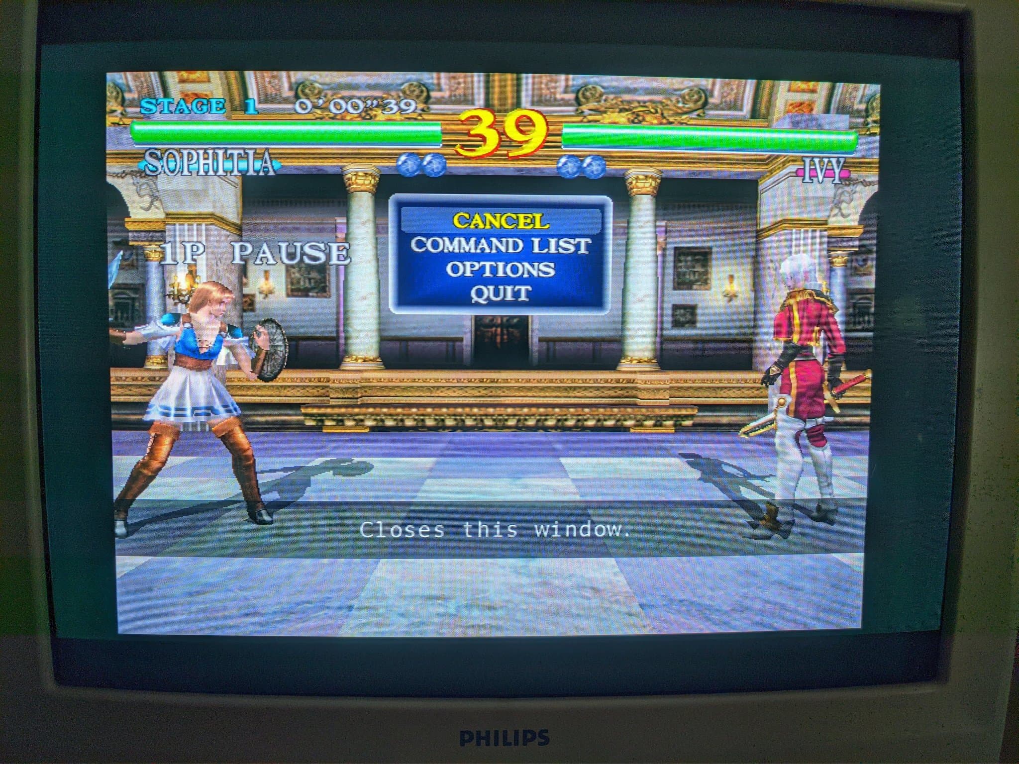 Soul Calibur on the Philips 109S4 CRT showing Sophitia facing an opponent, pause menu overlay visible.