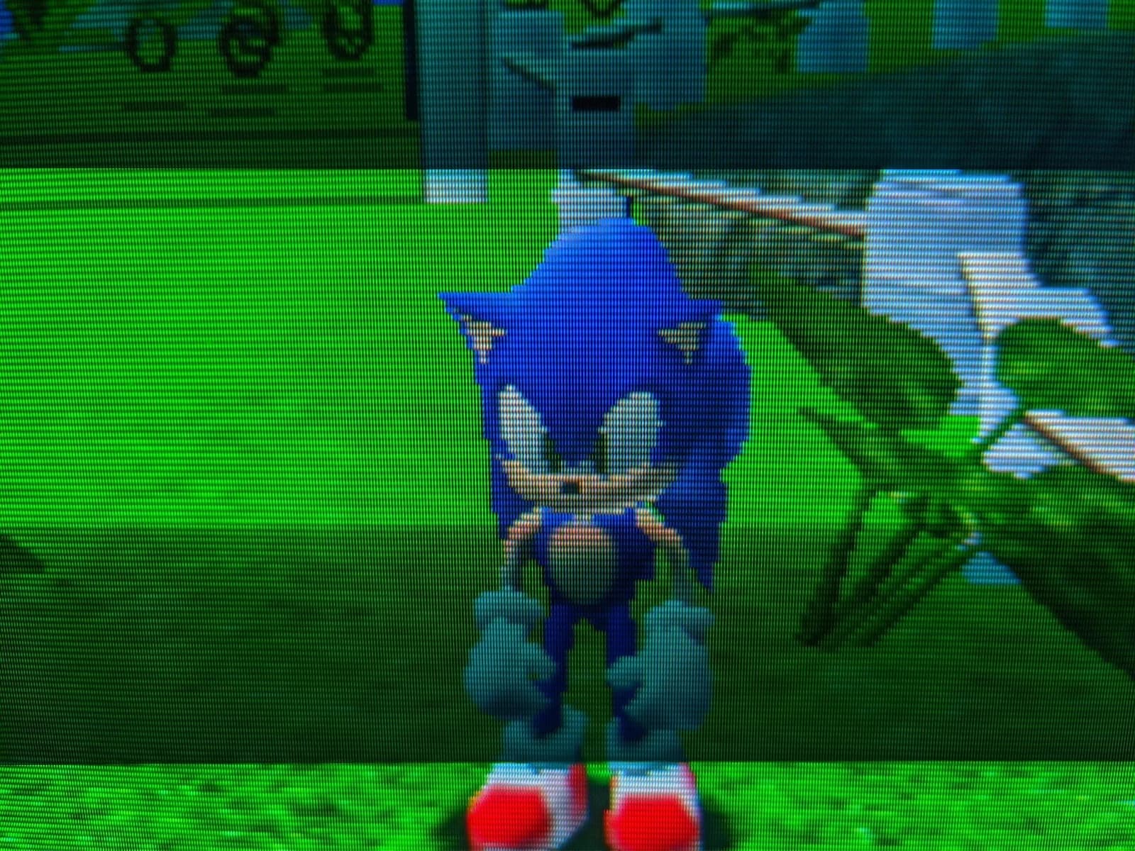 Sonic Adventure on the Sony CPD-G420, Sonic standing on a bright green grassy clifftop.