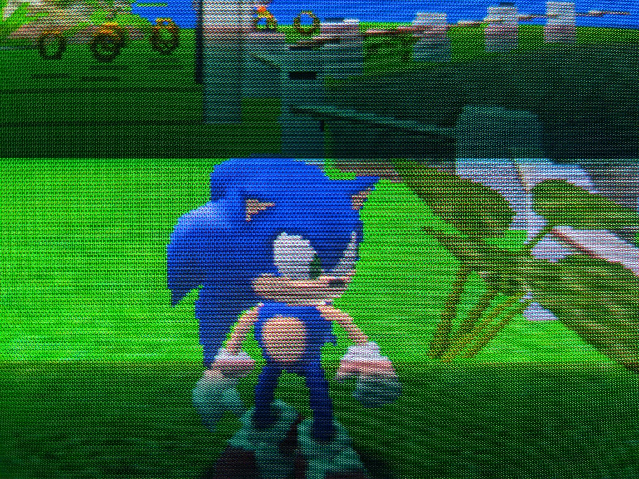 Close-up of Sonic Adventure on the Sony CPD-G420, Sonic mid-stride across a green grassy field after the repair.